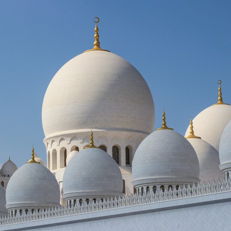 white and gold dome building under blue sky during daytime
